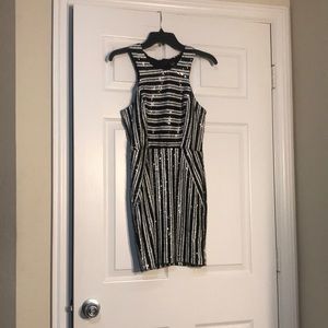 Black and white sequined mini dress. Sleeveless. Size 4